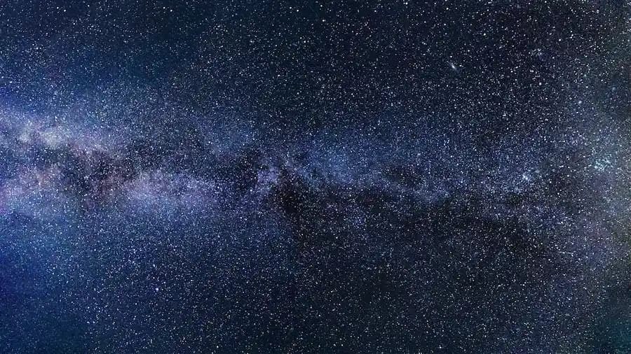 An image of outer space with a lot of stars.