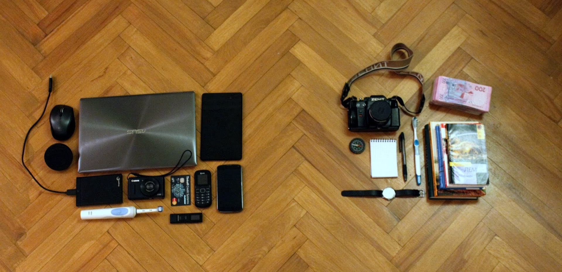 Laptop, smartphone and other digitals devices on the left side and books, notepad and other old things on the right side