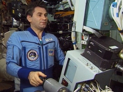 Russian cosmonaut Vasily Tsibliev controlling Progress remotely from Mir