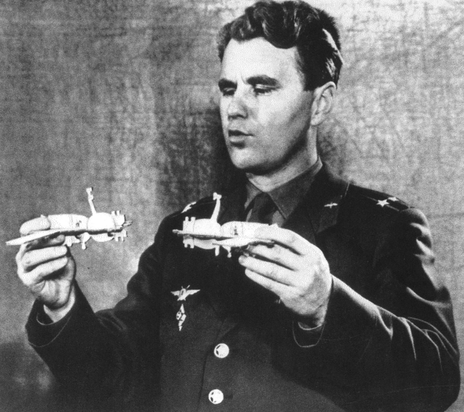 Soyuz 4, 8, and 10 cosmonaut Vladimir Shatalov demonstrates docking of two spaceships